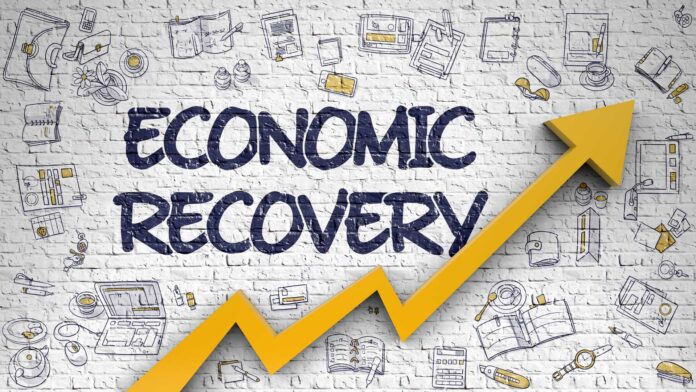 White,Brickwall,With,Economic,Recovery,Inscription,And,Orange,Arrow.,Development